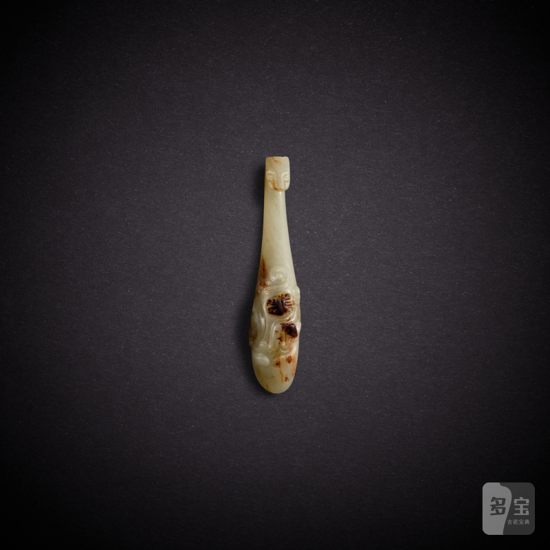 A pale celadon jade 'chilong' belt hook, Han dynasty | 漢 青白玉螭龍紋帶鉤